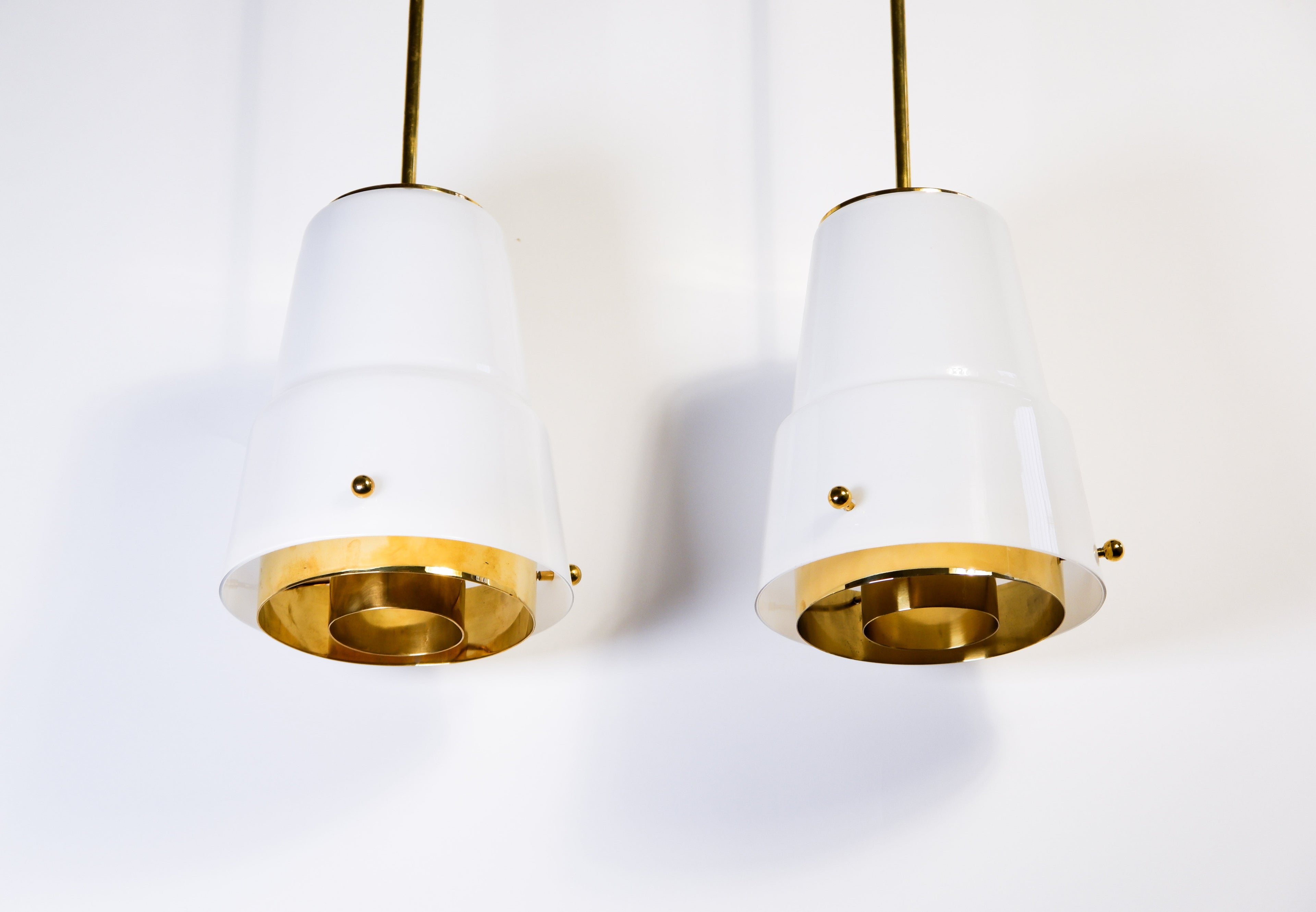 Paavo Tynell, pair of pendant in opal & brass, Idman circa 1940.