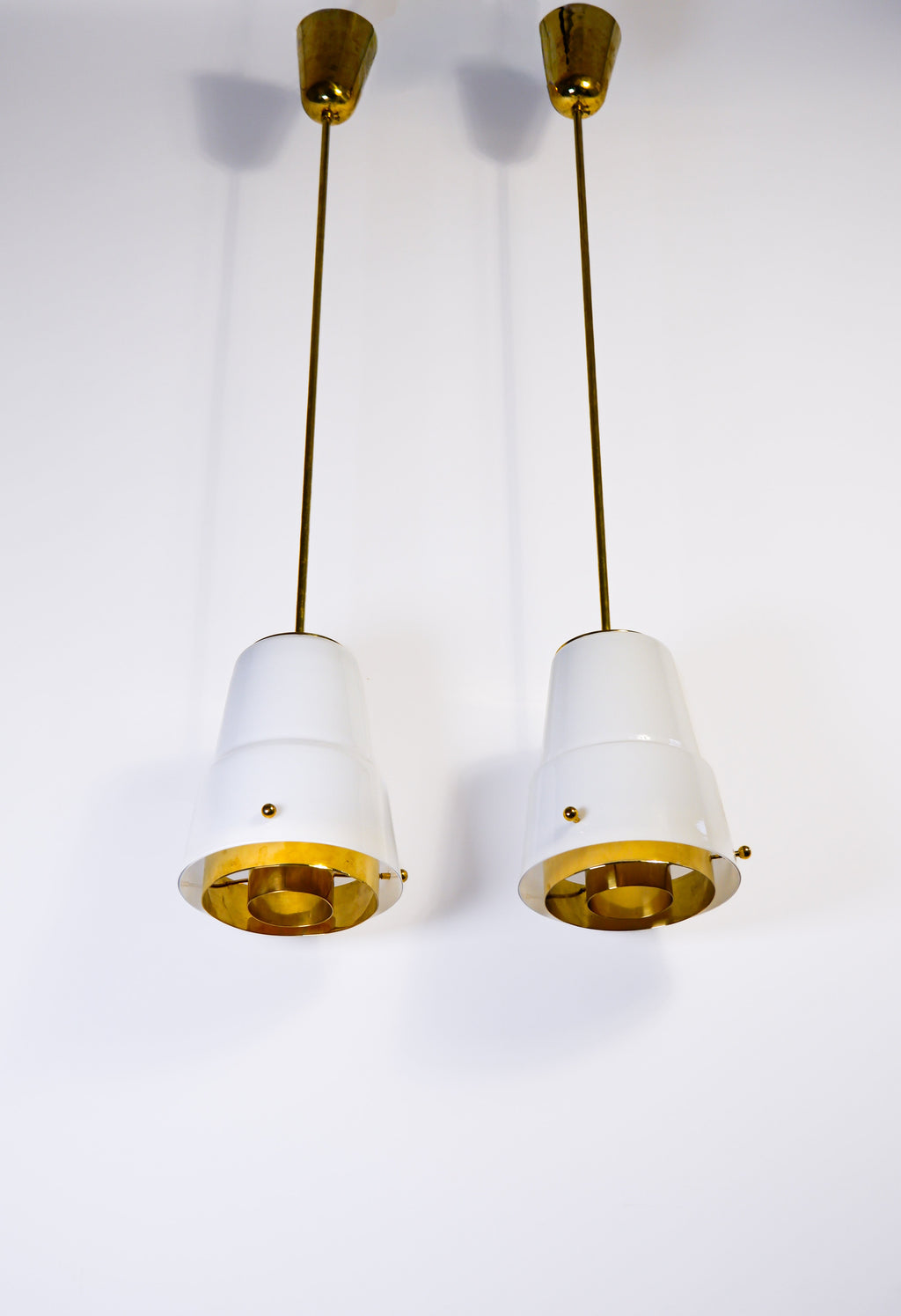 Paavo Tynell, pair of pendant in opal & brass, Idman circa 1940.
