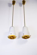 Paavo Tynell, pair of pendant in opal & brass, Idman circa 1940.