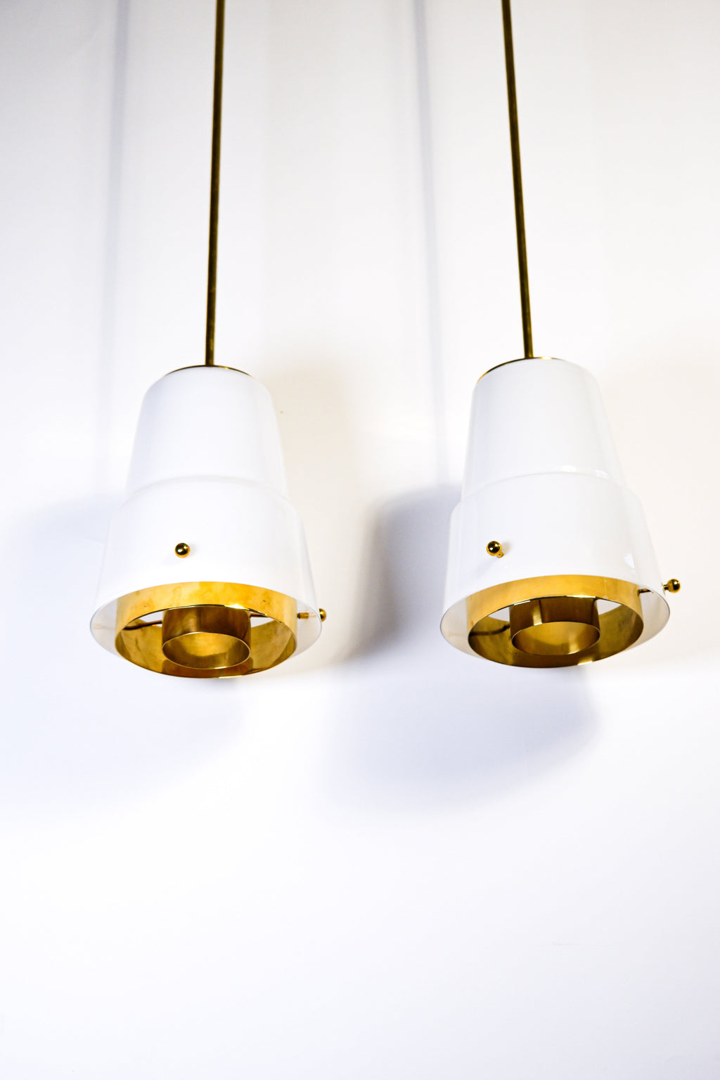Paavo Tynell, pair of pendant in opal & brass, Idman circa 1940.