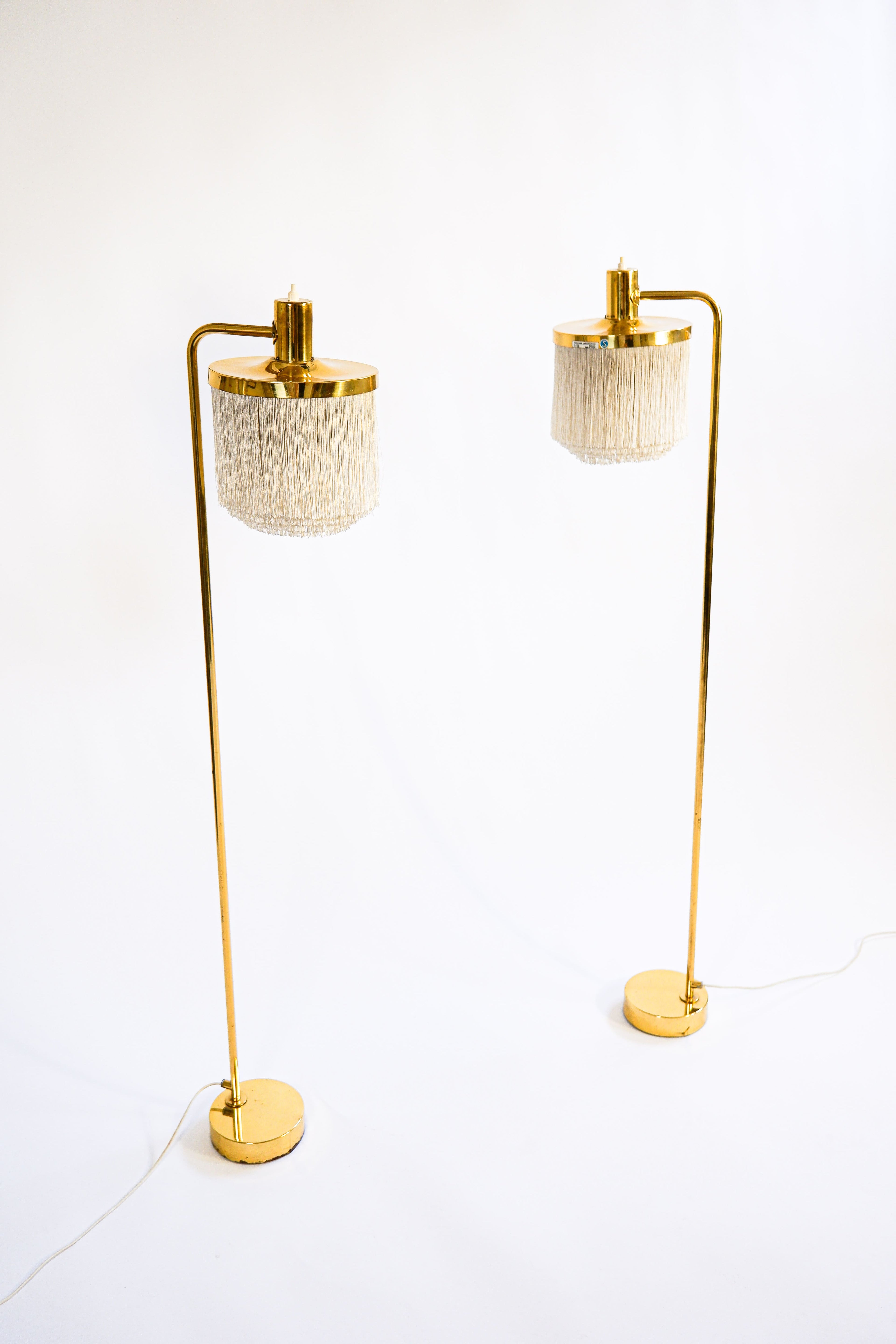 Hans Agne Jakobsson pair of Floor lamp model G 109. Cira 1960