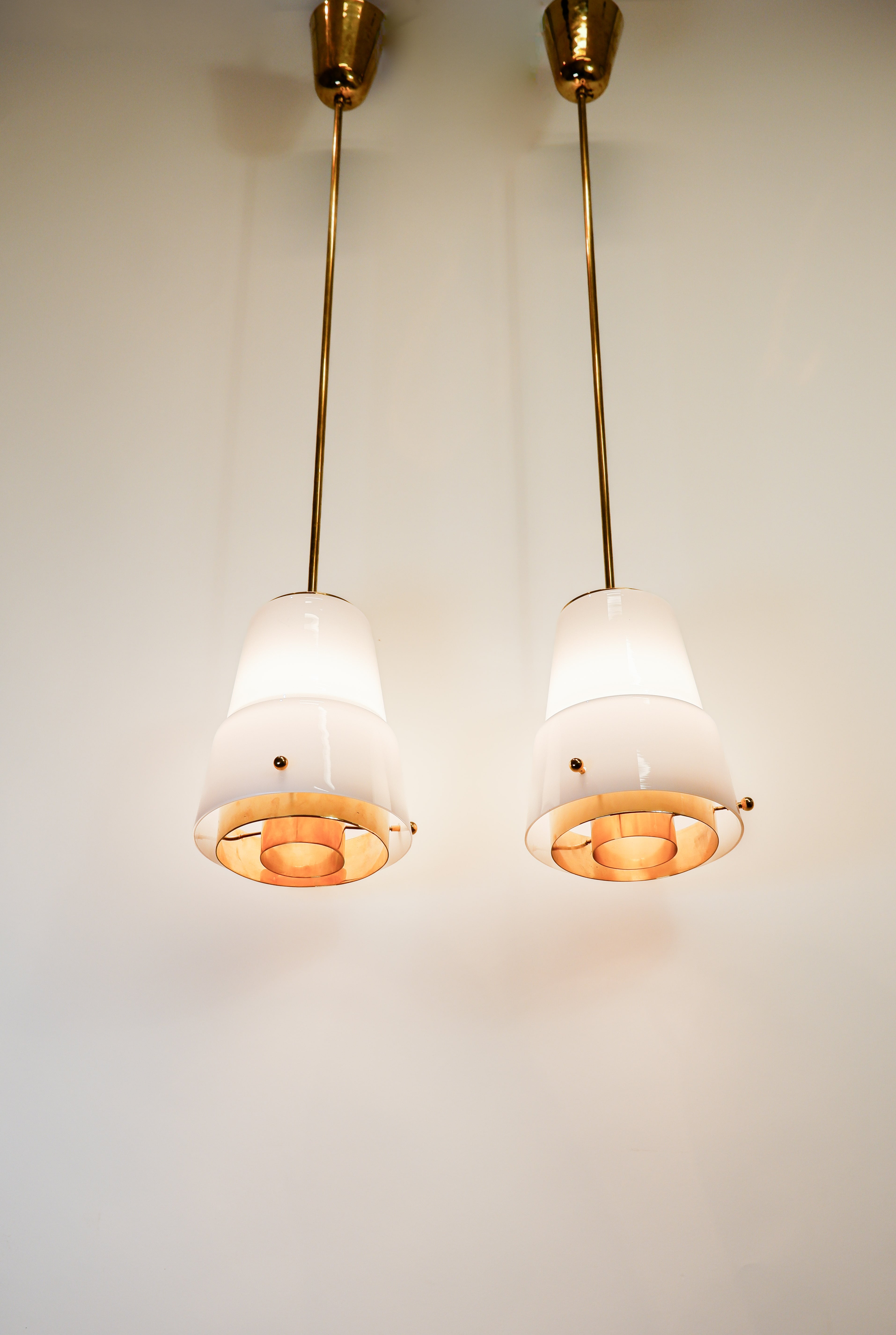 Paavo Tynell, pair of pendant in opal & brass, Idman circa 1940.