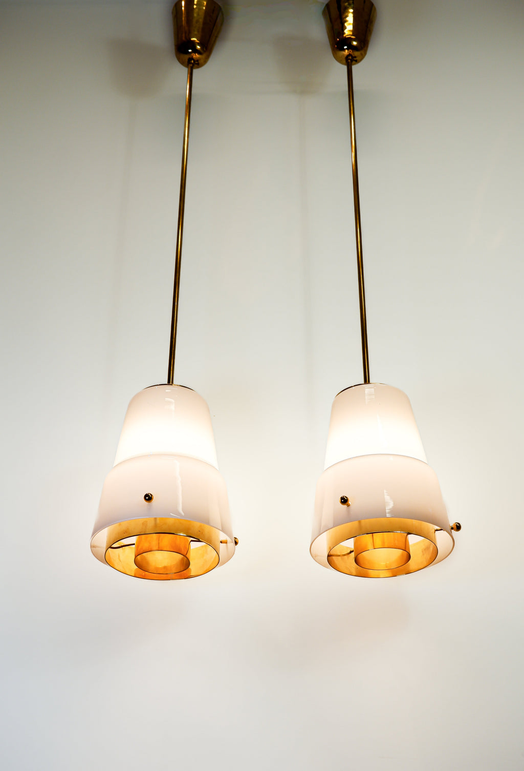 Paavo Tynell, pair of pendant in opal & brass, Idman circa 1940.
