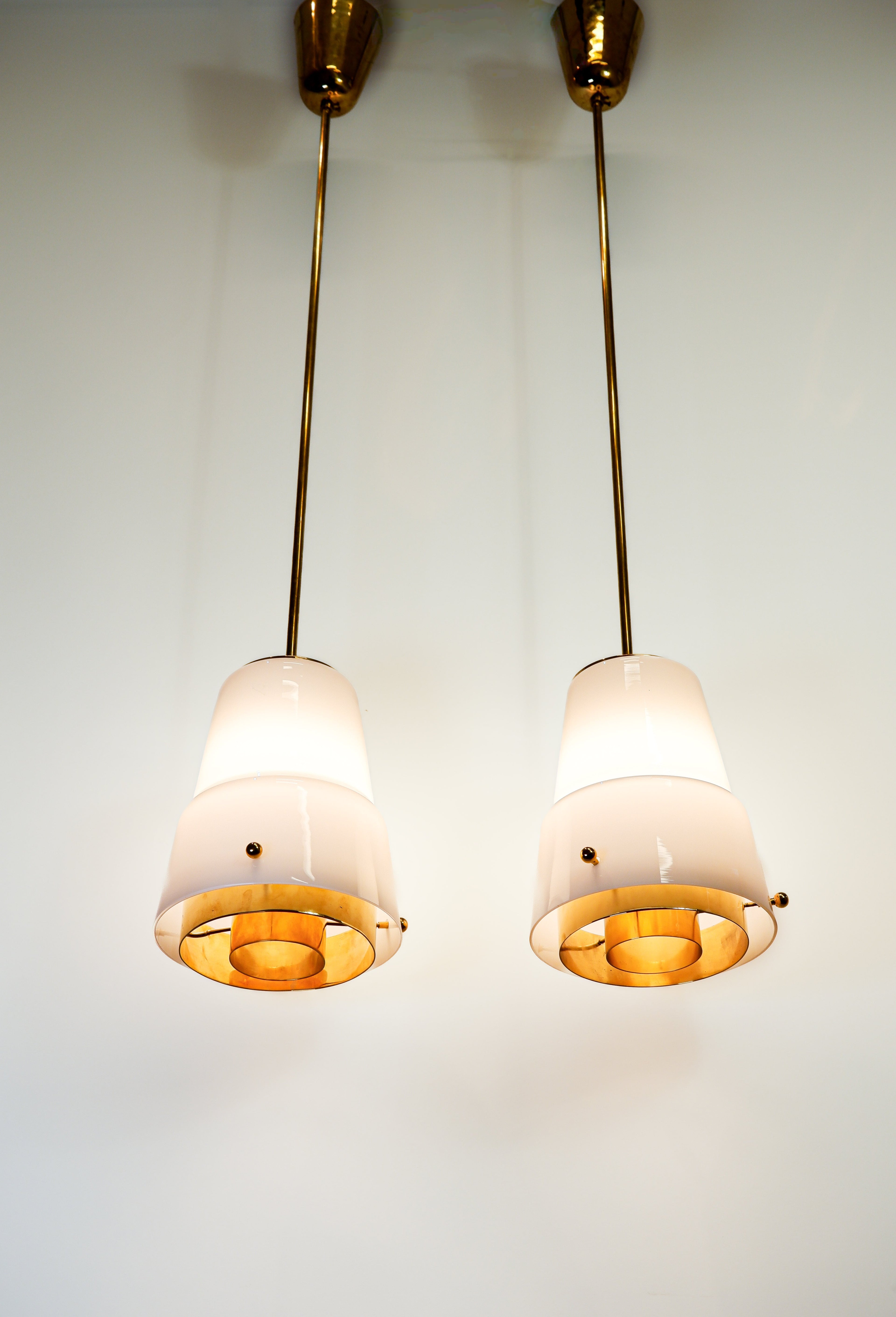 Paavo Tynell, pair of pendant in opal & brass, Idman circa 1940.