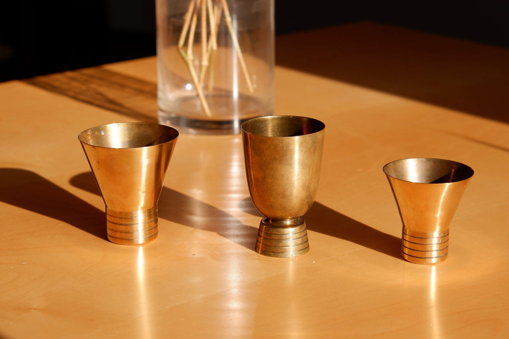 Set of three brass cups designed by Paavo Tynell for TAITO circa 1940