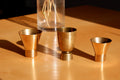 Set of three brass cups designed by Paavo Tynell for TAITO circa 1940