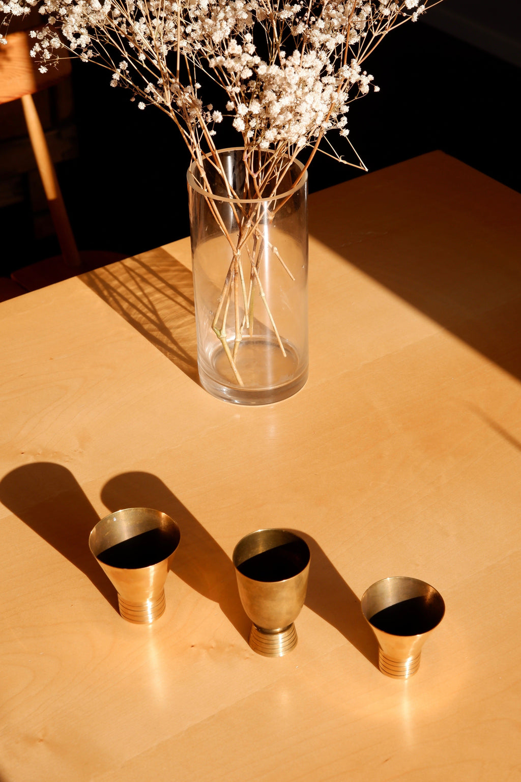 Set of three brass cups designed by Paavo Tynell for TAITO circa 1940