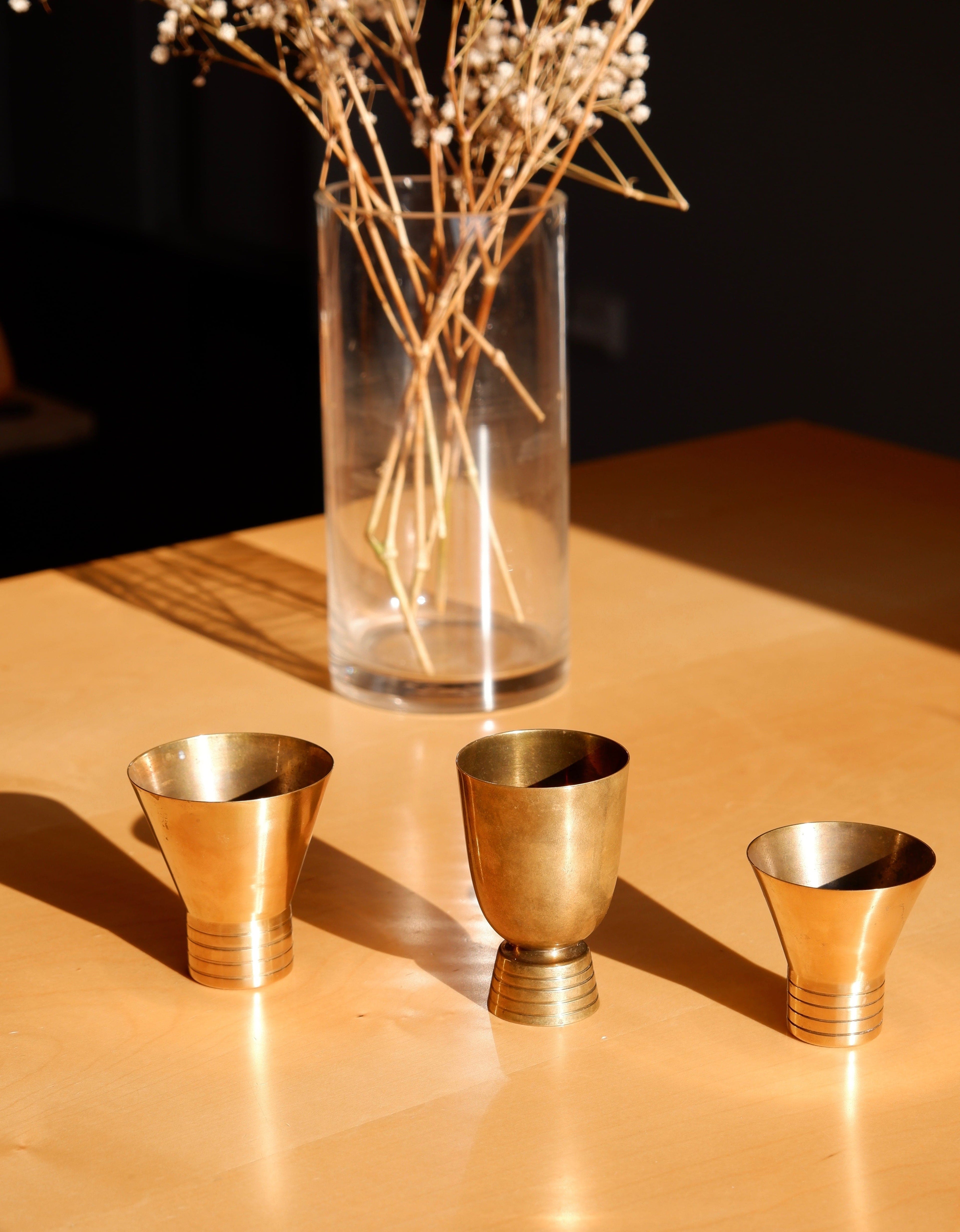 Set of three brass cups designed by Paavo Tynell for TAITO circa 1940
