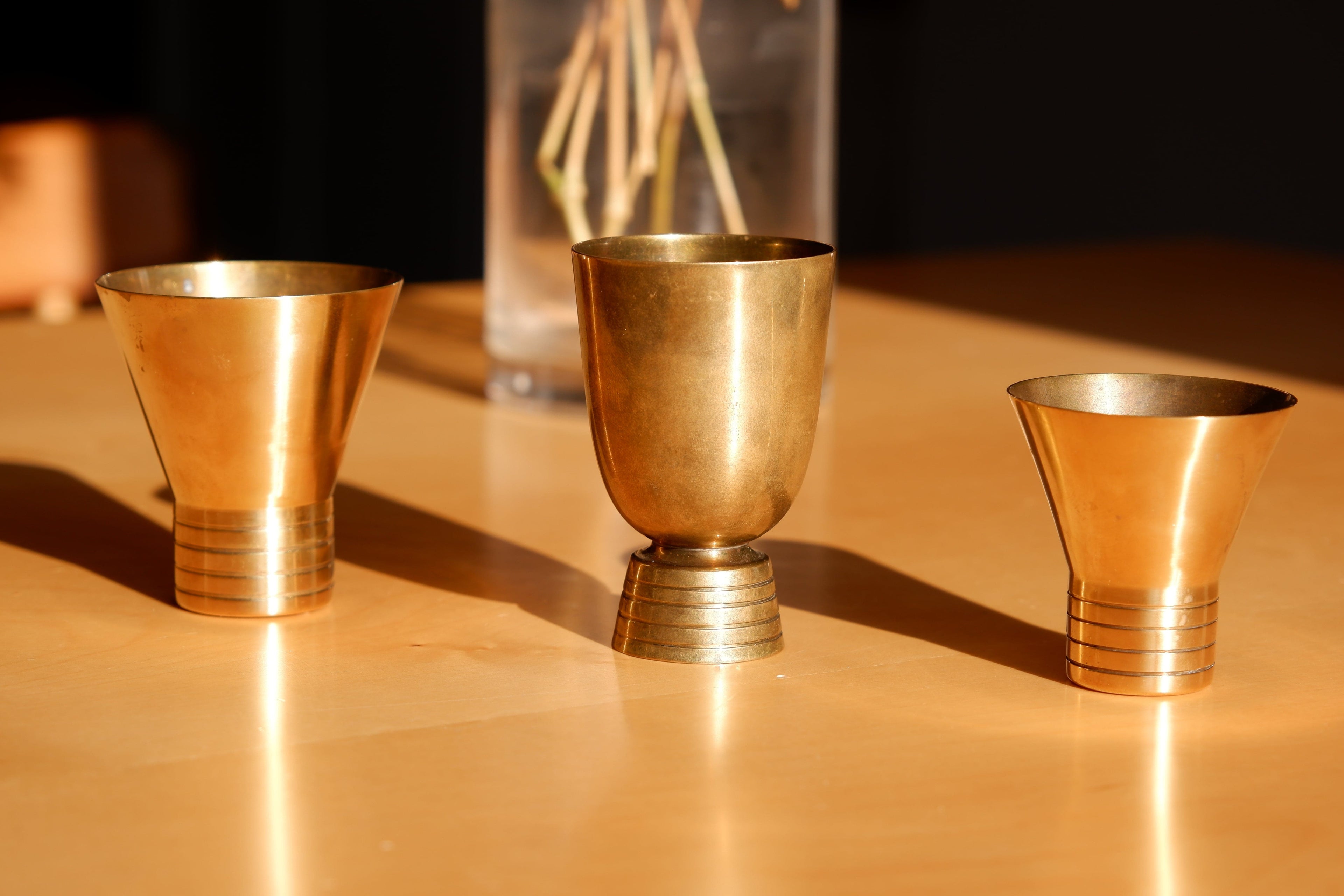 Set of three brass cups designed by Paavo Tynell for TAITO circa 1940