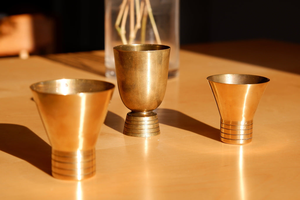 Set of three brass cups designed by Paavo Tynell for TAITO circa 1940