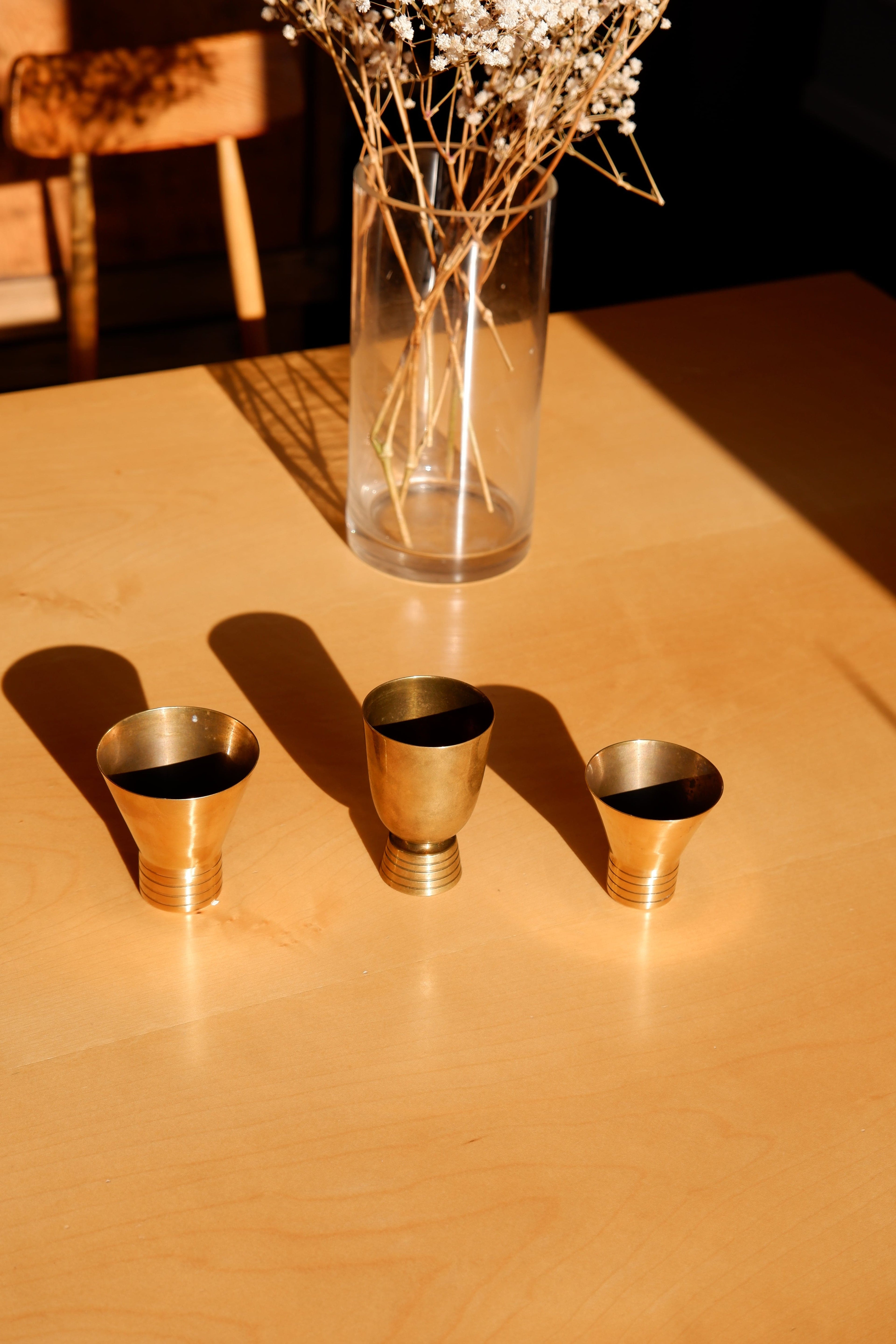 Set of three brass cups designed by Paavo Tynell for TAITO circa 1940
