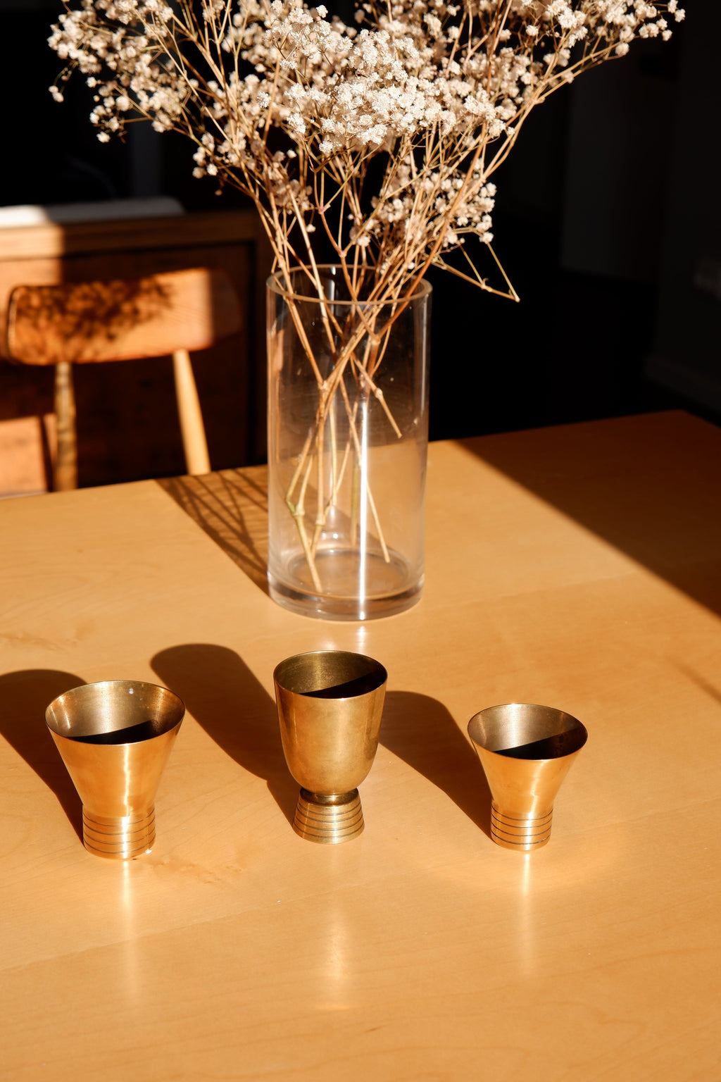 Set of three brass cups designed by Paavo Tynell for TAITO circa 1940