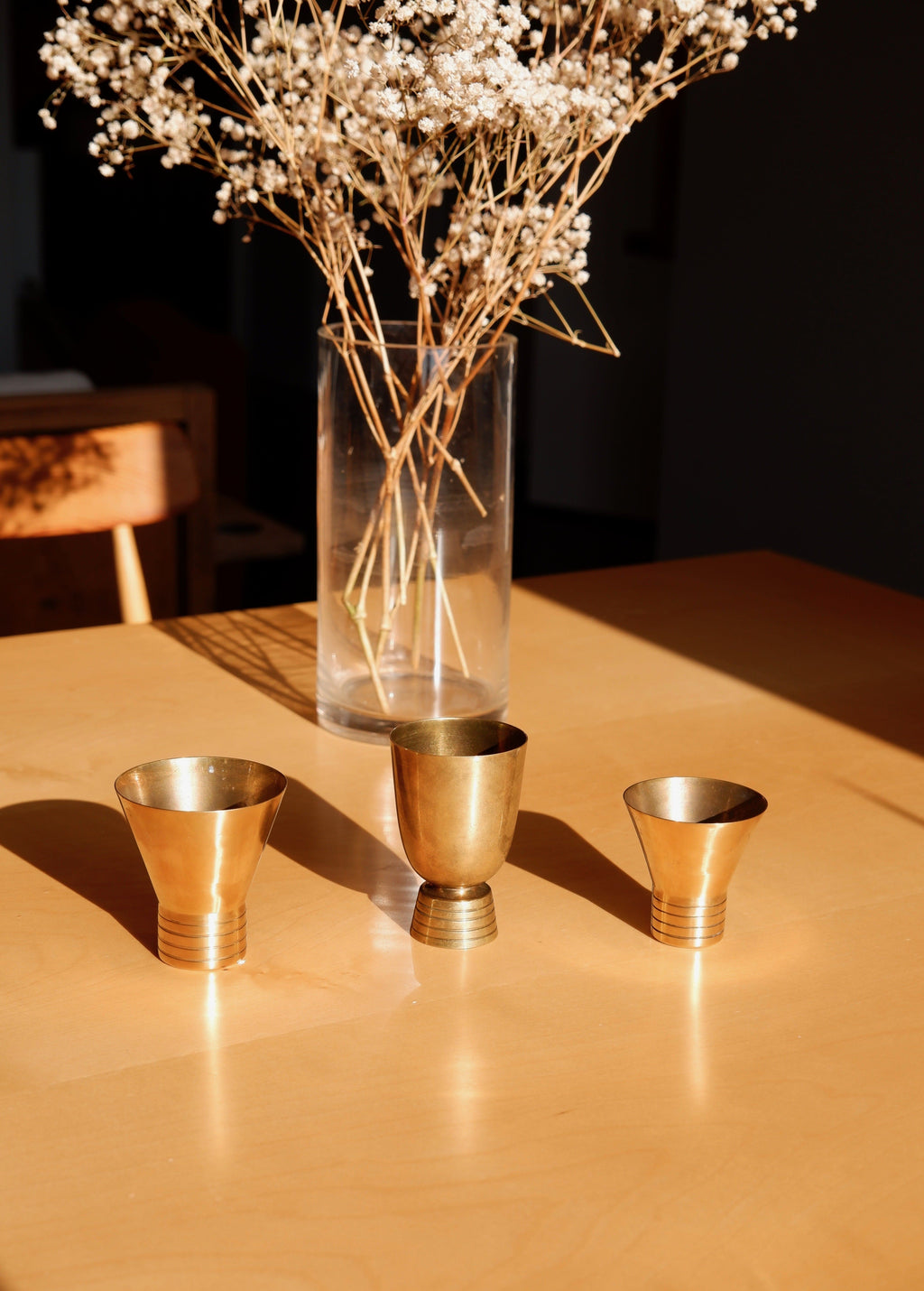 Set of three brass cups designed by Paavo Tynell for TAITO circa 1940